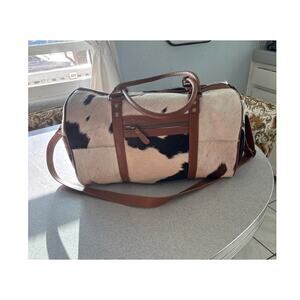 Pre-loved Hairon Hide Leather Onyx Traveler Bag by Myra